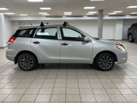 Silver light glances off the Titanium Metallic paint as it moves, the compact hatchback shape cuttin... (image 6)