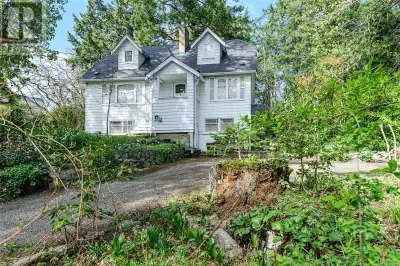 Development potential 1/2 acre with CLASSIC 1940s 2,500 sq ft, 2-bedroom home situated on a generous...