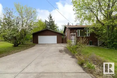 Welcome to Collingwood Cove. This 1,800+ sq ft cedar bungalow, built in 1940, is nestled on two spac...