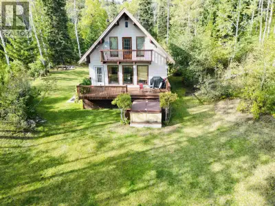 Exceptional 3-bed, 2.5-bath home on 150 private acres just minutes from Burns Lake. Impeccably maint...