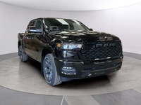 The 2026 Ram 1500 Big Horn, presented in a commanding Black finish and equipped with a robust 4x4 dr... (image 6)