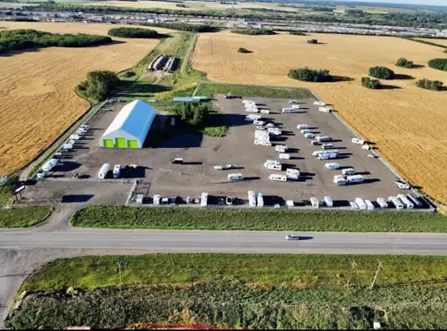 Rare opportunity on 11th St., West. 16,000 ft.² Cover All with 2 acres of fenced compound. Separatio...