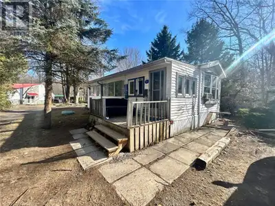 Discover this delightful year-round mobile home in Sandy Acres! Nestled in a peaceful, forested sett...