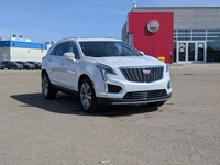 The pre-owned 2024 Cadillac XT5 Premium Luxury AWD in Mary Kay Pearl with a Jet Black interior deliv... (image 8)
