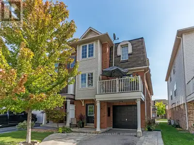 Welcome to this fabulous 3-bedroom, 2-bath end-unit townhome located in the highly sought-after Bron...