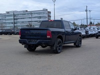 The pre-owned 2021 Ram 1500 Classic Express Crew Cab in Patriot Blue Pearl with a Black and Diesel G... (image 6)