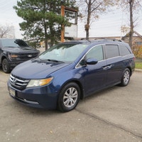 This 2016 Honda Odyssey EX-L Passenger Van is a spacious and reliable choice for your family adventu... (image 2)