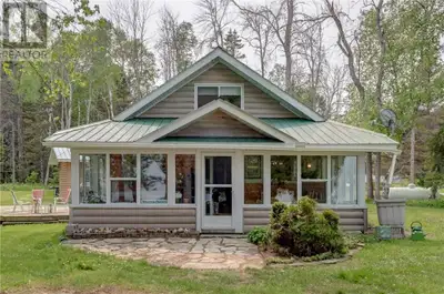 Embrace beach waterfront living on beautiful Manitoulin Island with this charming year-round home or...