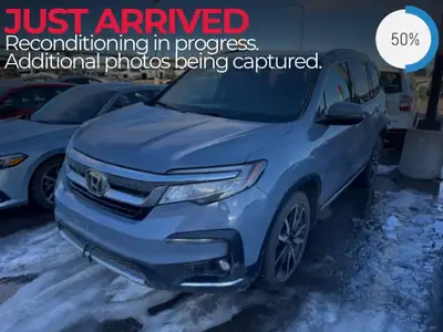 The 2022 Honda Pilot Touring 8-Passenger AWD in a sophisticated Gray finish offers versatility and s...