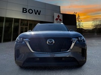 The 2025 Mazda CX-90 MHEV GS-L in a sophisticated gray finish beckons those seeking a premium drivin... (image 1)
