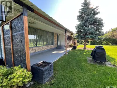 This very clean 1422 Sq. ft. 4 bedroom bungalow sits on +/- 12.10 acres of established shelter belts...