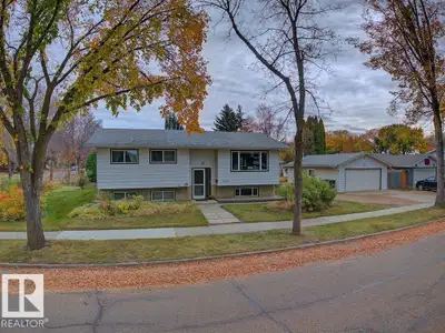 Welcome home to this fully developed 1,108 sq. ft. bi-level, situated on a landscaped corner lot wit...