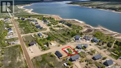 SERVICED FLAT LOT, ONE BLOCK BACK FROM THE LAKE WITH TREES AND WITH ELECTRICAL PANEL INSTALLED, WATE...