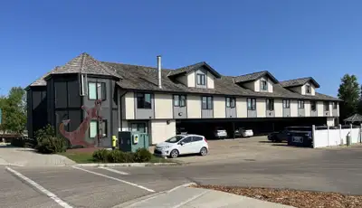 Imagine waking up steps from the shimmering waters of Sylvan Lake, with everything this vibrant town...