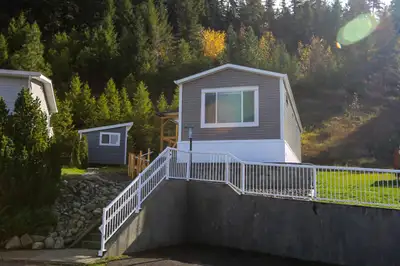 This could be your view! Brand new 16' wide manufactured home on beautiful landscaped site in the 55...