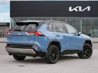 The highly anticipated 2025 Toyota RAV4 Hybrid XSE, a striking light blue Sport Utility with a sophi... (image 5)