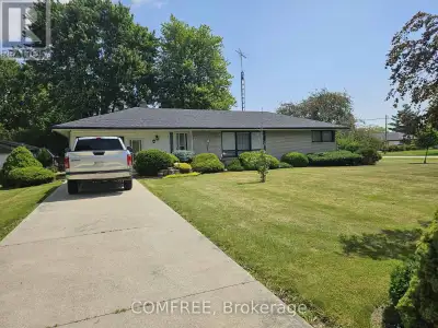 Welcome to this charming custom-built brick ranch, ideally situated on a spacious approximately 130'...