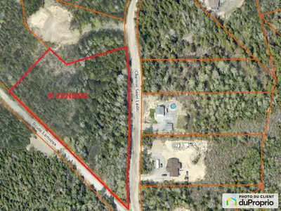 Grand terrain boisé pour construction résidentielle dans le quartier Sainte-Odile à seulement 10 min...