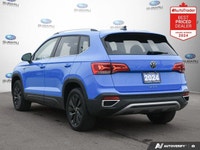 New Price! Odometer is 10494 kilometers below market average! Blue 2024 Volkswagen Taos Comfortline... (image 4)