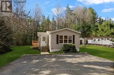 Welcome to Shady Pines Mobile Home Park! This charming home features a bright and open layout with t...