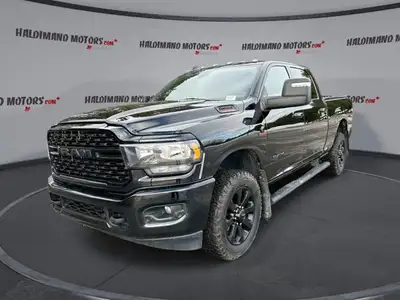 Meet the 2023 RAM 2500 Big Horn 4x4 Crew Cab 6'4 Box with the Night Edition package, offered by Hald...