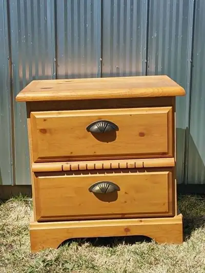 2-drawer nightstand / bedside table in very good condition. Solid wood top and drawer fronts with a...