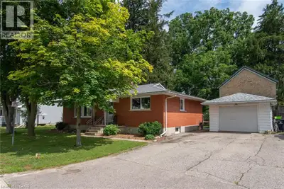 Welcome to this well cared for solid all-brick bungalow nestled on a lovely dead end street! This pr...