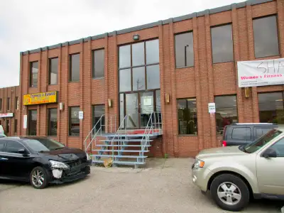 Renovated second floor office space divided into open area and 2 private offices, excellent exposure...