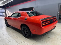 Meet the 2022 Dodge Challenger GT in a vibrant orange finish, gracefully combined with an AWD drivet... (image 5)