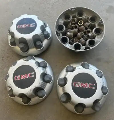 4 GMC 8 stud hub caps with nuts $95 Make an offer