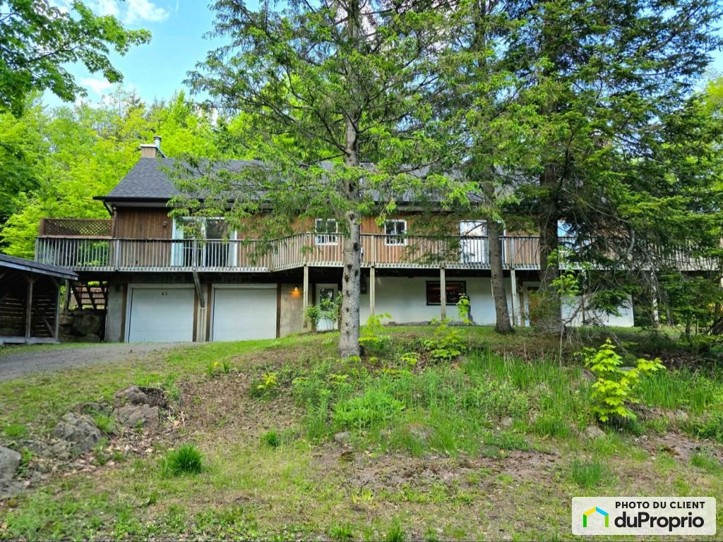 $540,000 - Raised Bungalow for sale in Ste-Anne-Des-Lacs — photo 1