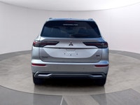 Introducing the 2026 Mitsubishi Outlander Plug-In Hybrid SE S-AWC, gliding in with a captivating sil... (image 3)