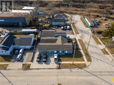 Single-floor industrial building with 3 units, totaling 4,000 square feet. Features include 2 overhe...