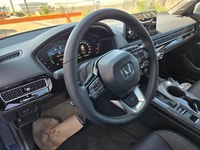 NEW TO CANADA? WE HAVE AN APPROVAL WAITING FOR YOU! The 2026 Honda Civic Hybrid Sport Touring is the... (image 9)