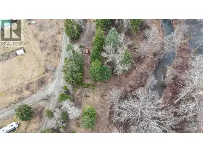 Rare opportunity to own a versatile 1.02 acre creek-front property in the welcoming community of Gre...