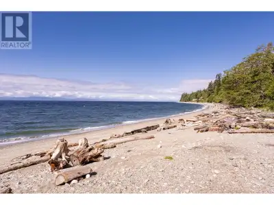 The prettiest cottage with outstanding beach access & views of the water situated on Gibson's finest...