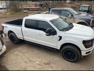 2024 f150 xlt white in colour lady driven in amazing condition, leveling kit, aftermarket rims and t...