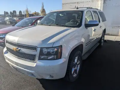 2012 Chevy Suburban LTZ!! Beige leather interior, 2nd row captains chairs, room for 7!! Alberta acti...
