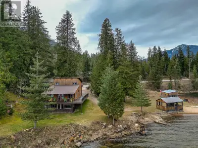Enchantment of lakefront living with this breathtaking 1.29 acre property on Three Valley Lake. Offe...