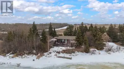 This rare 2.4-acre lakefront property on beautiful Sandy Beach offers the perfect canvas to create y...