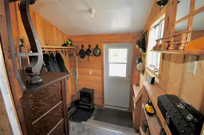 R32//Russell/Located just 4 miles west of Russell, this charming hobby farm offers a peaceful rural...