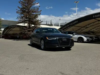 The 2012 Audi A6 3.0T Premium Plus marks a significant peak in the mid-size luxury sedan segment, bl...