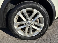 This 2012 Nissan Juke (JAPANESE)is a reliable SUV with a stylish white exterior and a sleek black in... (image 6)