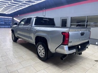 The 2025 Toyota Tacoma SR5, clad in a refined Silver finish, is ready to tackle any terrain with its... (image 5)