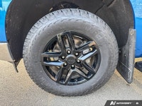 Command the road and conquer any task with this robust Blue 2024 Chevrolet Silverado 1500 LTZ. Equip... (image 8)