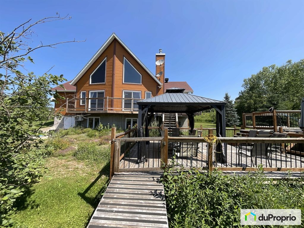 $749,999 - Price Taxes Not Included - Cottage in Mandeville — photo 1