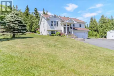 Set on a beautifully landscaped 1.24-acre lot, this immaculate four-bedroom, three-bathroom home off...