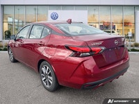 Designed for efficiency and confident urban navigation, this vibrant red 2024 Nissan Versa SV, is yo... (image 1)