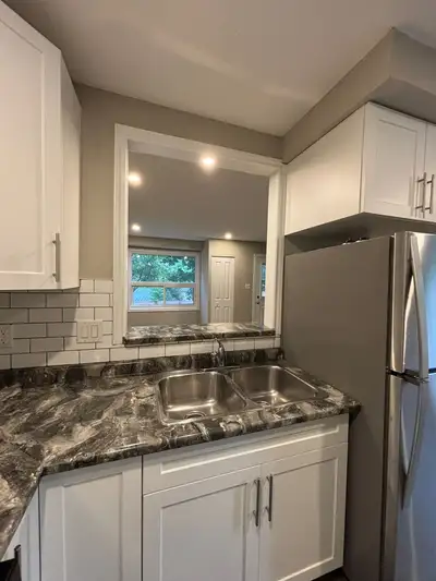 RENOVATED 2-BEDROOM TOWNHOUSE WITH AC & FINISHED BASEMENT