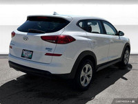 The 2020 Hyundai Tucson in Crystal White features all-wheel drive with advanced safety like lane dep... (image 5)